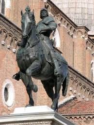 a horse statue in front of a brick building