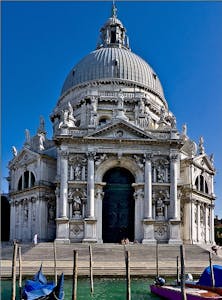 a large building with Santa Maria della Salute in the background