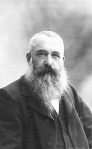 Claude Monet with a beard looking at the camera