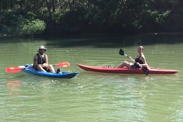 Two people enjoying a kayak trip on the Meramec River