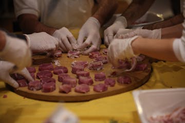 hands working with meat
