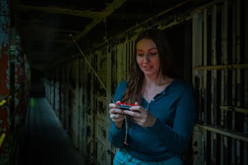 a woman holding a cell phone