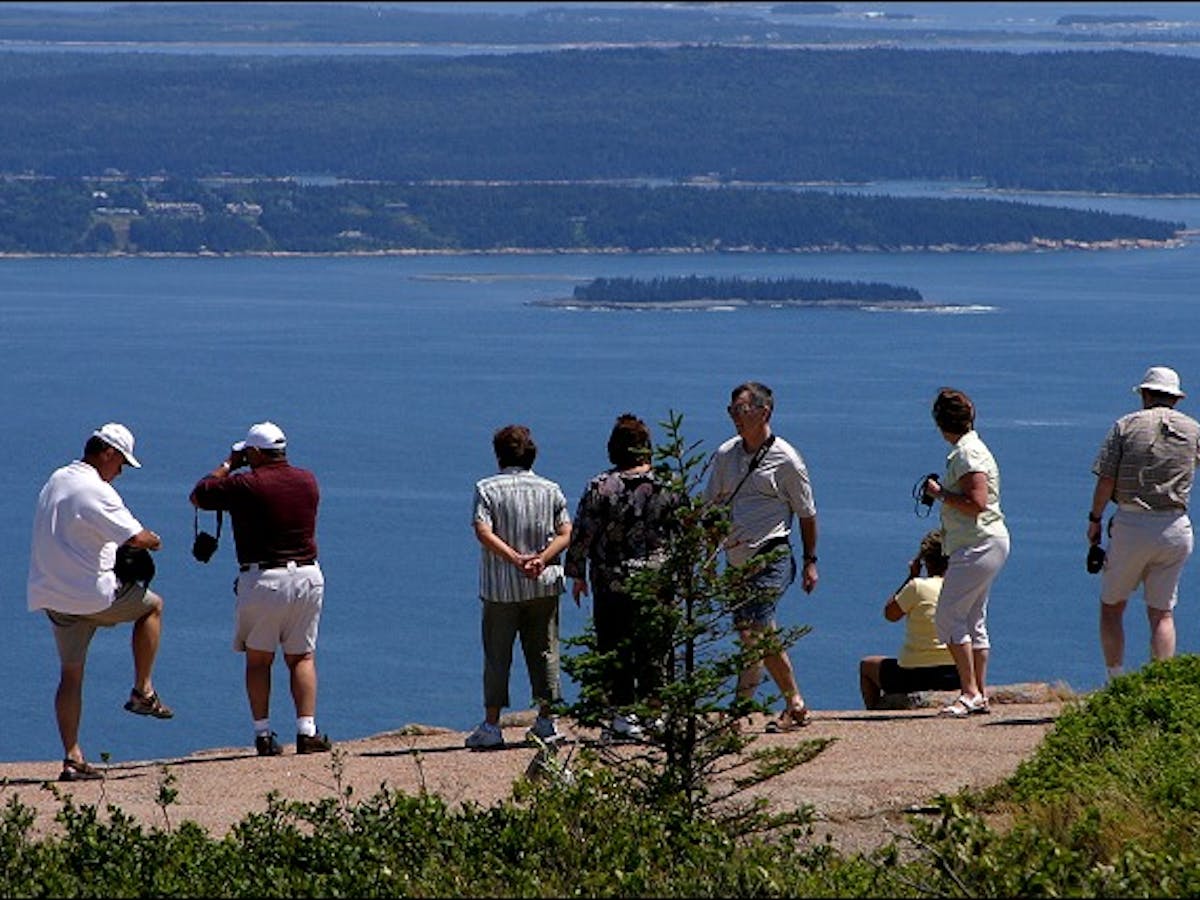 Group of people standing on lookout in Acadia National Park