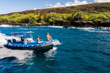 People riding in blue dive boat