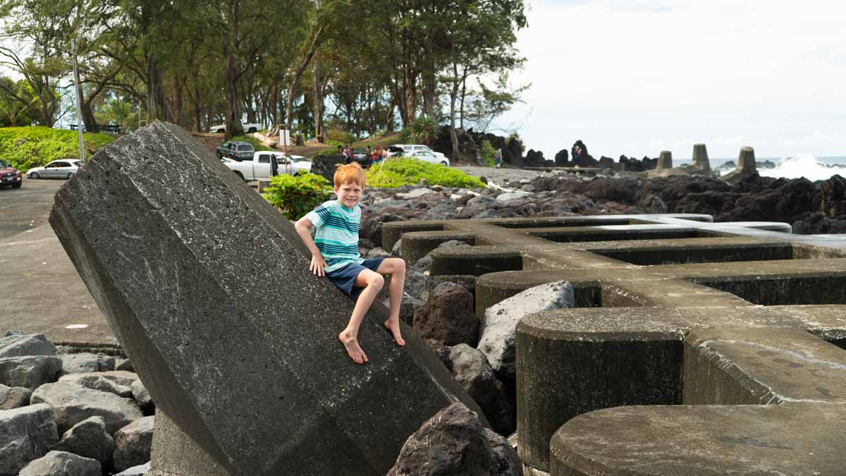 a man sitting on a rock