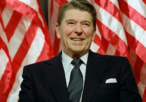 Ronald Reagan wearing a suit and tie