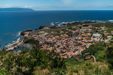 View from a viewpoint onto a village at the coast and the sea