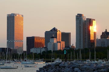 Milwaukee skyline along Lake Michigan during a sunrise
