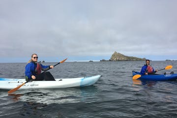 Two ocean kayakers smiling for the camera