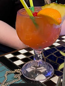 a glass of a Hurricane cocktail