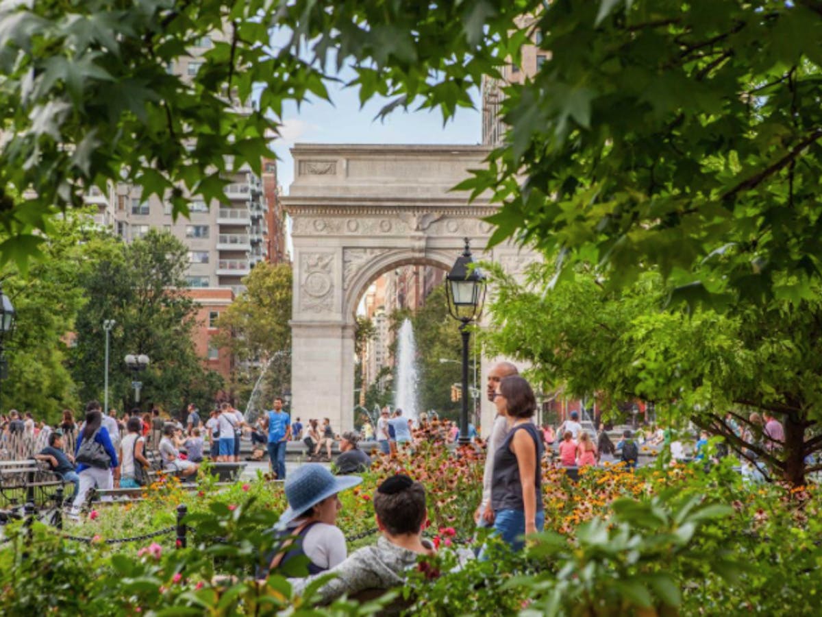 a group of people in washington square park nyc
