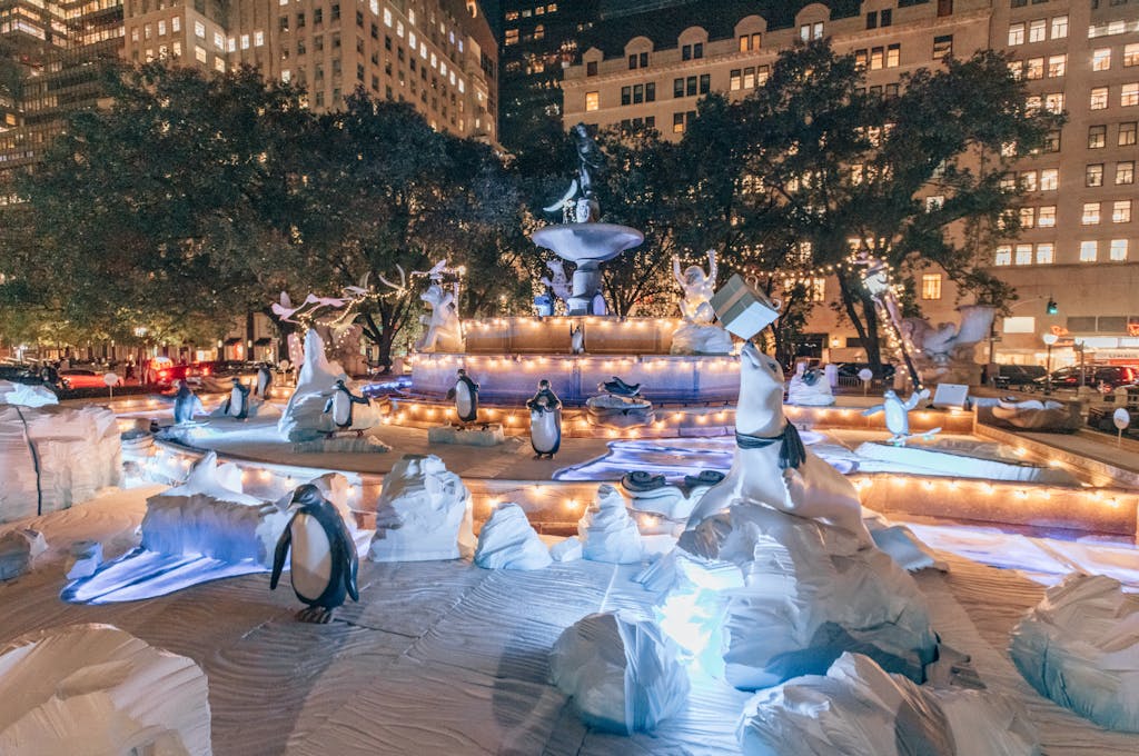 animal statues lit up at pulitzer fountain nyc