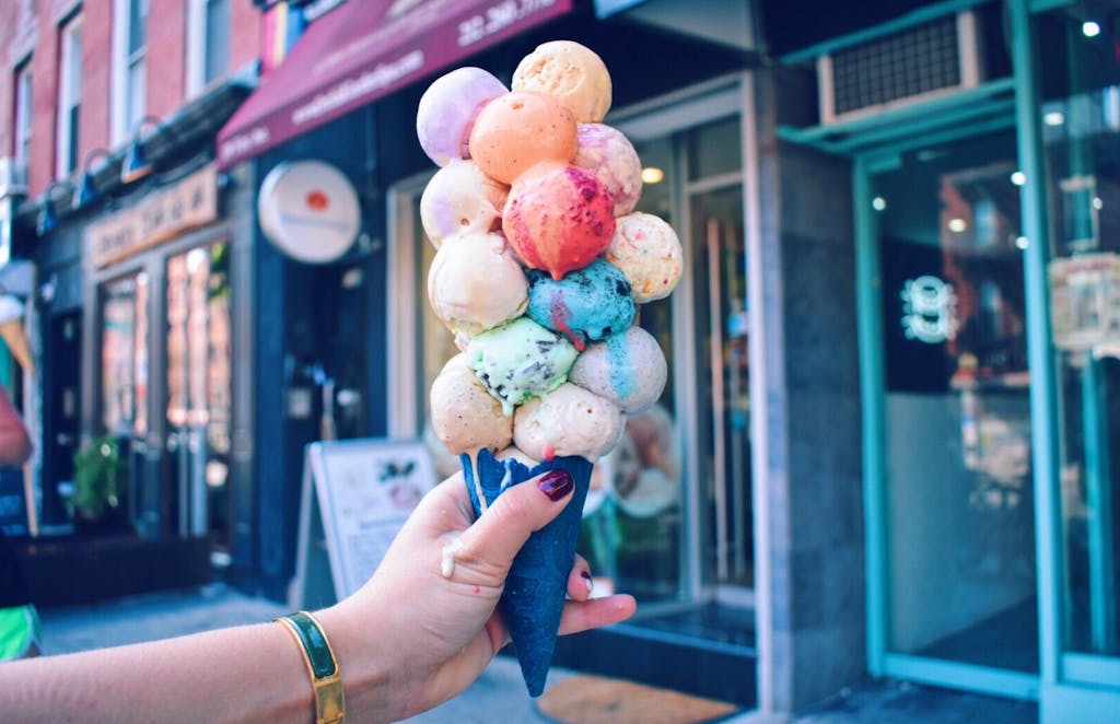 huge ice cream cone overloaded with scoops