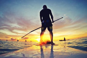 man on stand-up paddle board