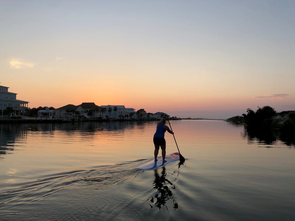 sunset paddle boarding