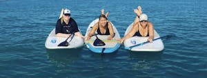 3 girls laying on paddle board in gulf shores Alabama