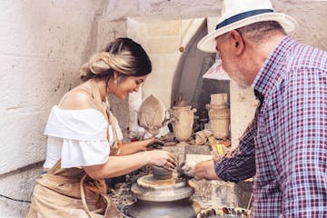 Woman and man making pottery