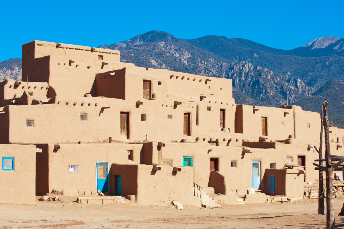 Taos Pueblo with a mountain in the background