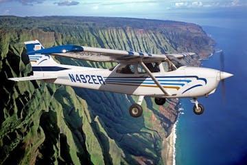 Wings Over Kauai's Cessna tour plane flying over Hawaii