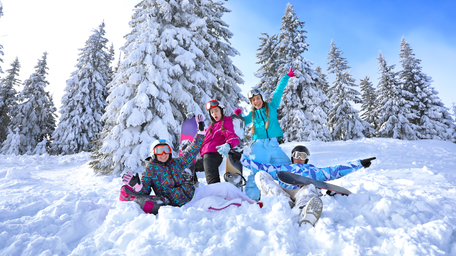 a group of teenagers sitting in the snow in Pagosa Springs Colorado