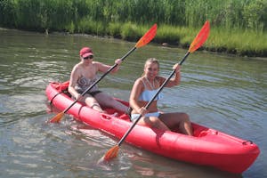 A couple in a tandem kayak