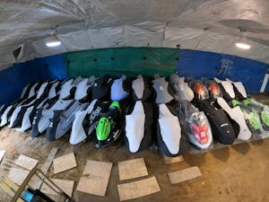 jetskis stored inside in a line for the winter