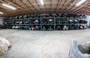 jetskis stored inside of a warehouse