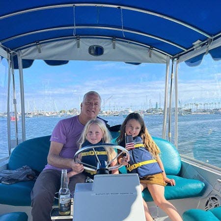 Family Enjoying Electric Duffy Boat Ride