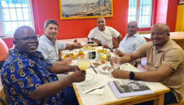 a group of people sitting at a table