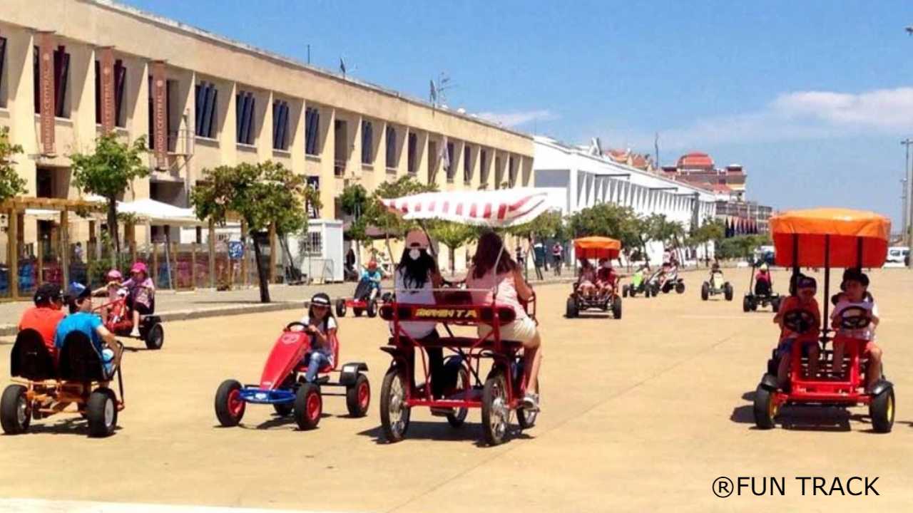 a group of people riding on the back of a horse drawn carriage