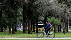 a person riding a bicycle in a park in Lisbon