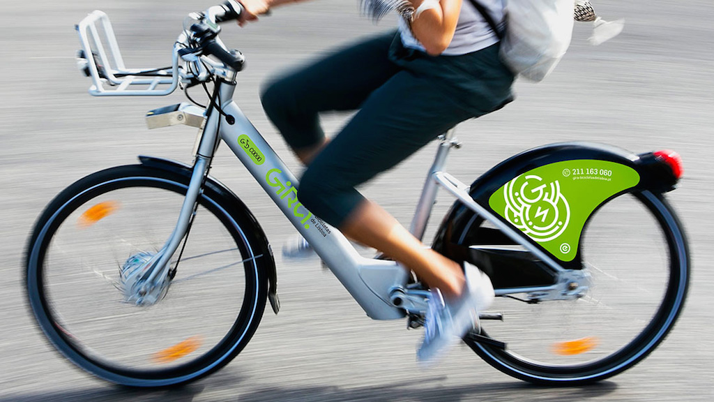 a person riding on the back of a bicycle