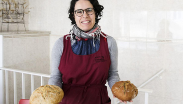 a woman holding a plate of food