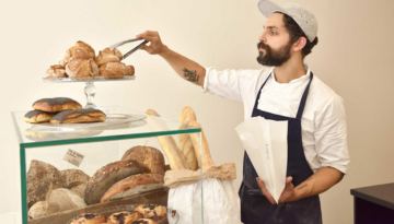 a man standing in a kitchen preparing food