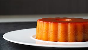 a plate of food with a slice of orange