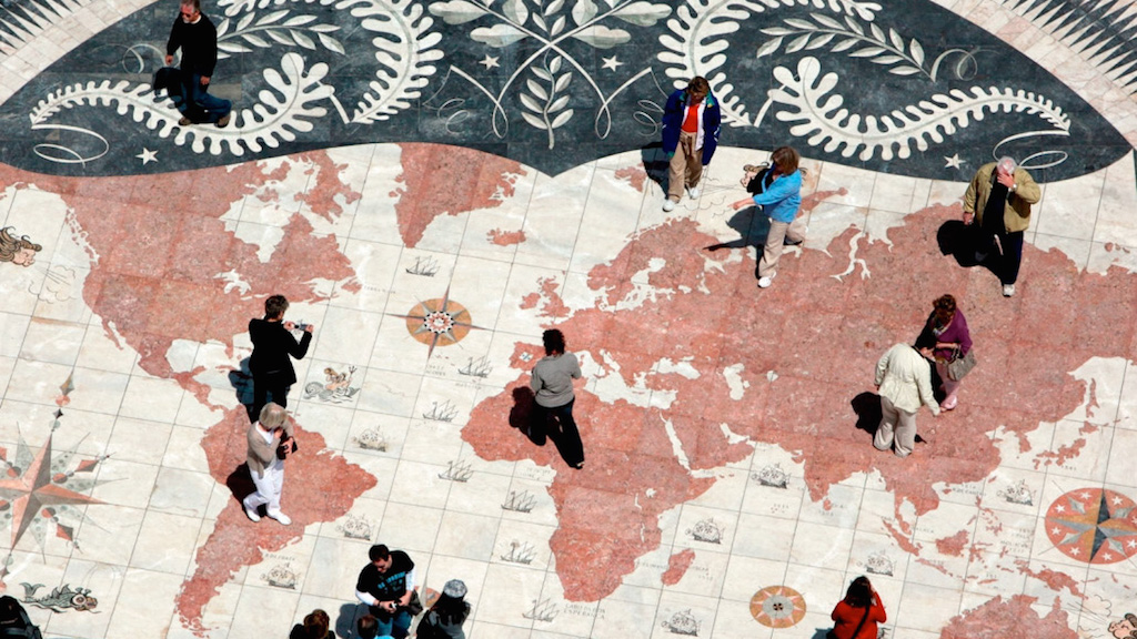 a group of people walking down the street