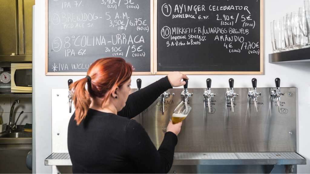 a woman standing in front of a blackboard