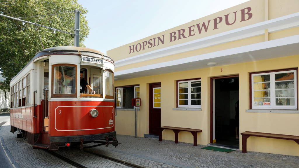 a train is parked on the side of a building