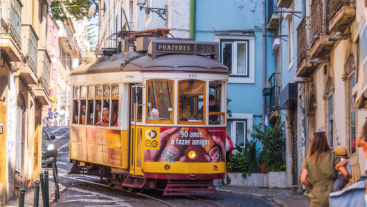 a train crossing a street in a city