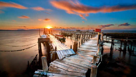 a sunset over a body of water