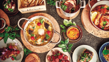 a bowl filled with different types of food on a table