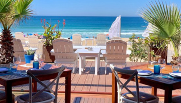 a dining table with a blue umbrella