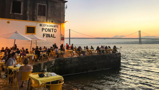 a group of people in a boat on a body of water