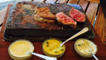 a plate of food on a wooden table