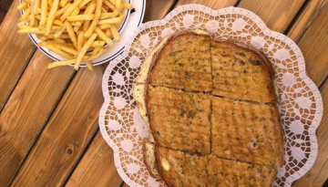 a piece of bread on a wooden table