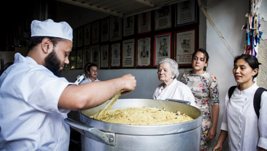 a person that is cooking some food