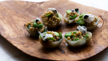 a plate of food sitting on top of a wooden table