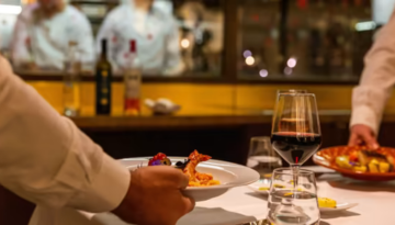 a man sitting at a table in a restaurant