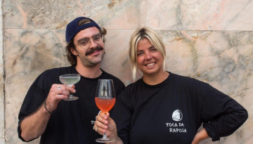 a person holding a glass of wine