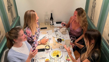 a group of people sitting at a table